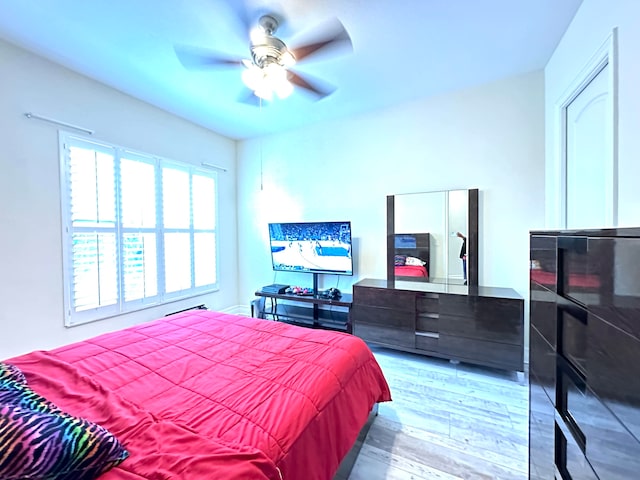 bedroom featuring wood-type flooring and ceiling fan