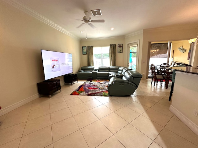 tiled living room featuring ceiling fan and crown molding