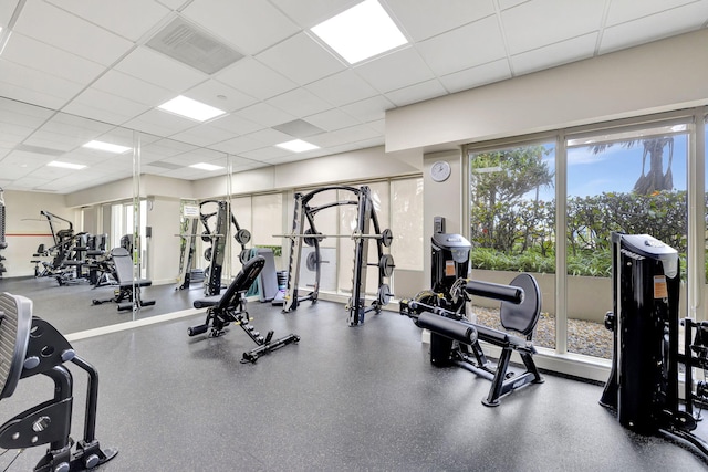 exercise room featuring a drop ceiling