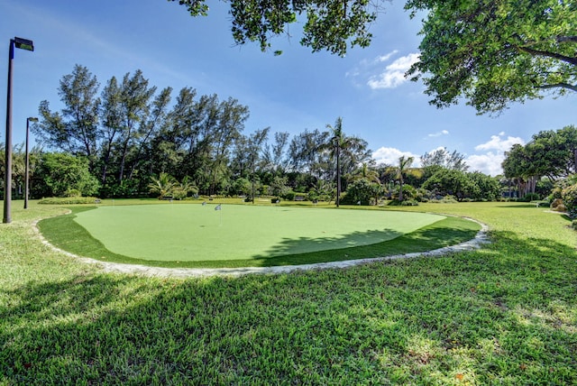 view of home's community featuring a lawn