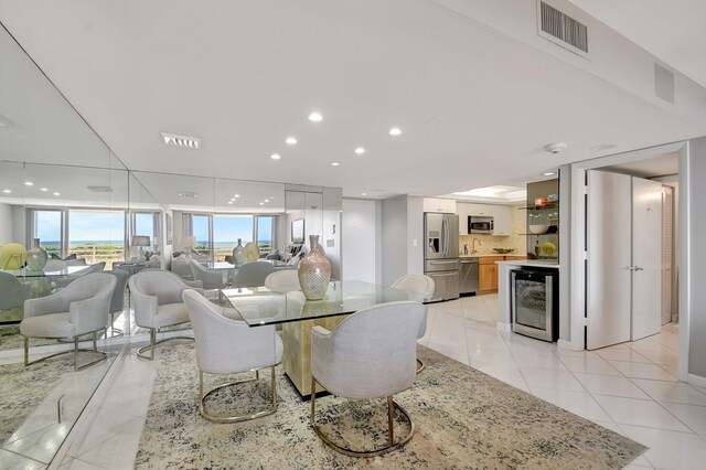 tiled dining space with beverage cooler