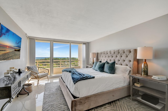 tiled bedroom featuring a textured ceiling