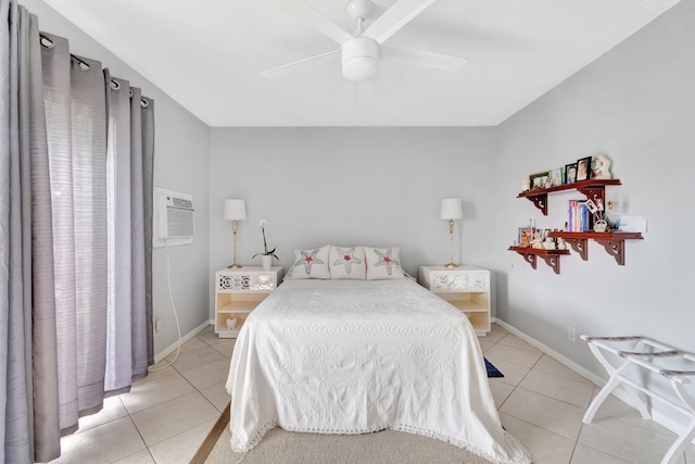 bedroom with an AC wall unit, light tile patterned floors, and ceiling fan