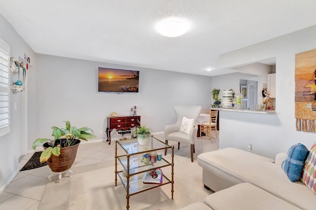 tiled living room with a textured ceiling