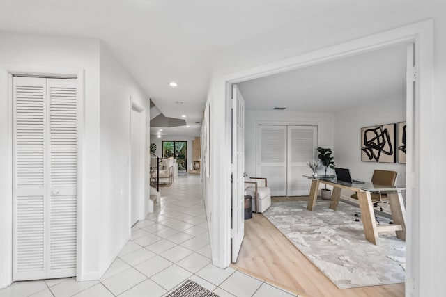 hallway featuring light tile patterned floors