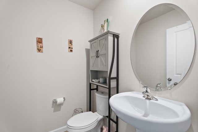 bathroom with toilet and sink