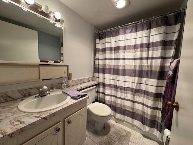 bathroom featuring a shower with curtain, tile patterned flooring, vanity, and toilet