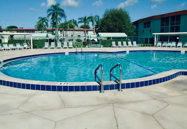 view of swimming pool featuring a patio