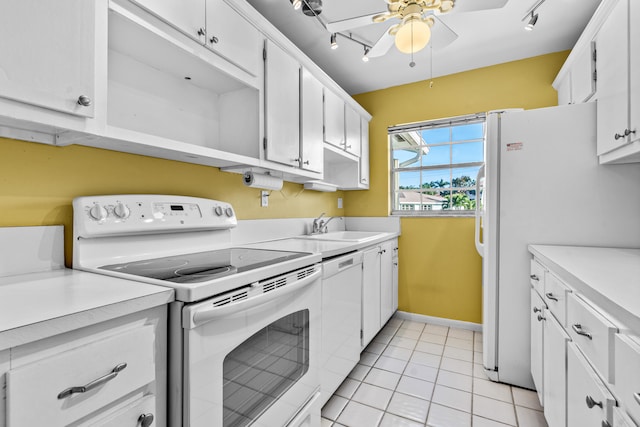 kitchen with white cabinetry, white appliances, and sink