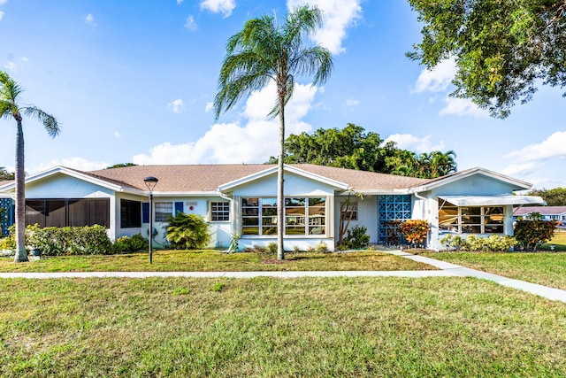 ranch-style house with a front yard