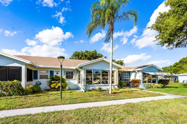 single story home featuring a front yard