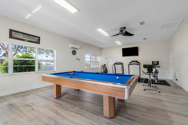 playroom featuring ceiling fan, light hardwood / wood-style floors, an AC wall unit, and pool table