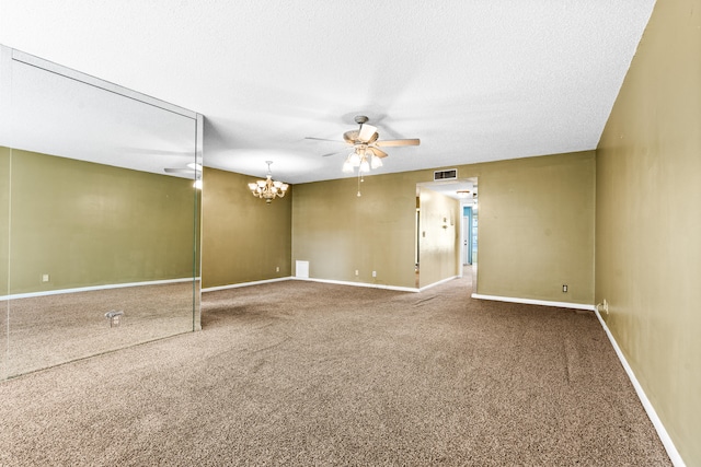 carpeted empty room with ceiling fan with notable chandelier and a textured ceiling