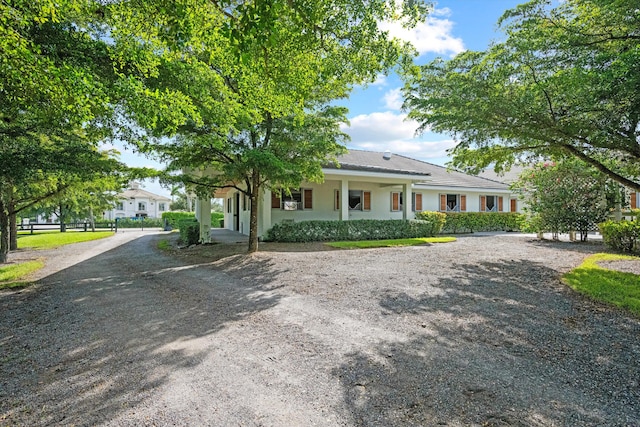 single story home featuring covered porch