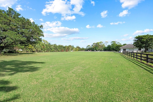 view of yard with a rural view