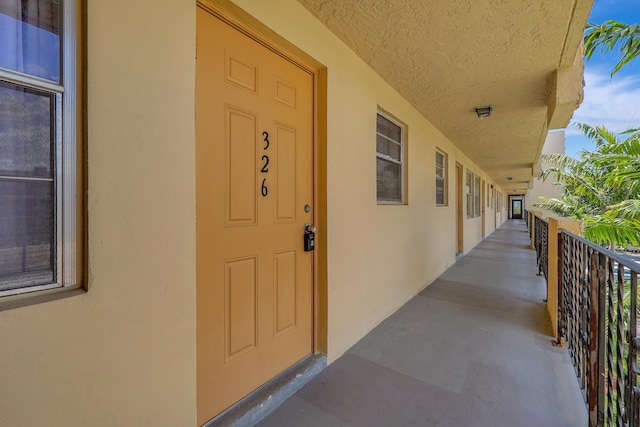2145 Pierce St Unit 326, Hollywood, FL 33020 - entrance to property with stucco siding and a balcony