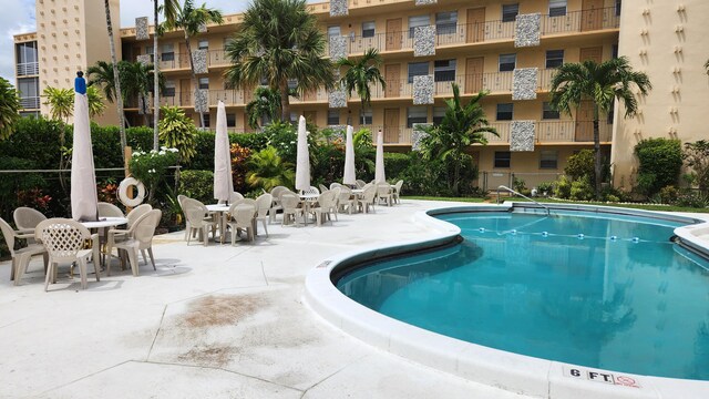 view of swimming pool with a patio area