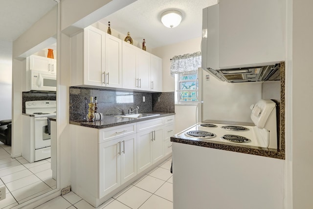 2145 Pierce St Unit 326, Hollywood, FL 33020 - kitchen featuring white appliances, a sink, light tile patterned floors, and white cabinetry