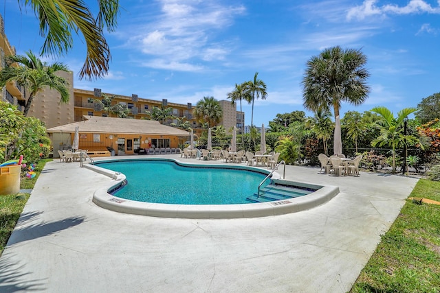 2145 Pierce St Unit 326, Hollywood, FL 33020 - community pool featuring a patio area and fence
