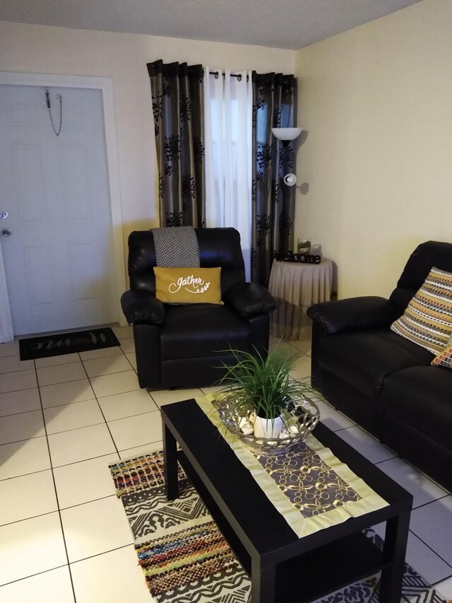 living room with light tile patterned floors