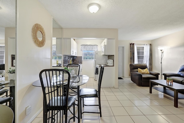 2145 Pierce St Unit 326, Hollywood, FL 33020 - dining room featuring a textured ceiling and light tile patterned floors