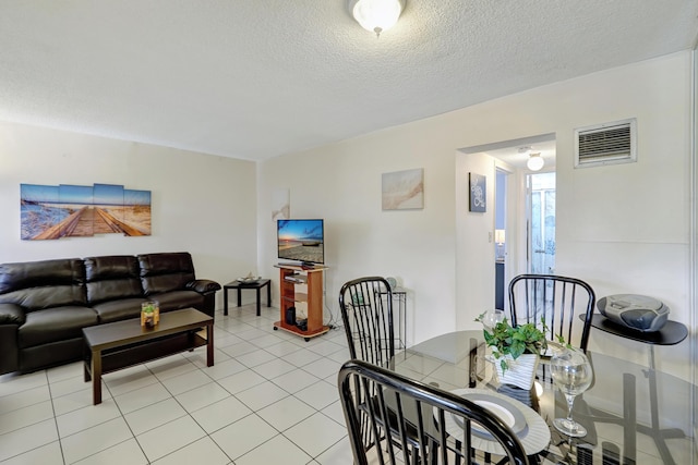 2145 Pierce St Unit 326, Hollywood, FL 33020 - dining space featuring light tile patterned flooring and a textured ceiling