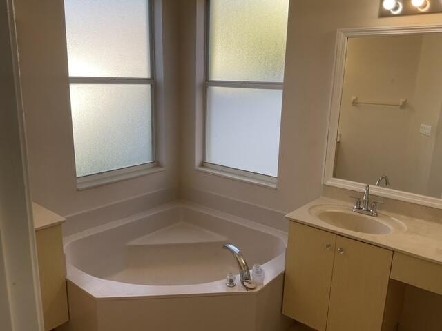 bathroom featuring vanity and a bathtub