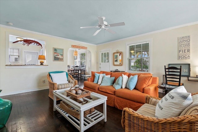 living room with ornamental molding, ceiling fan, and dark hardwood / wood-style flooring