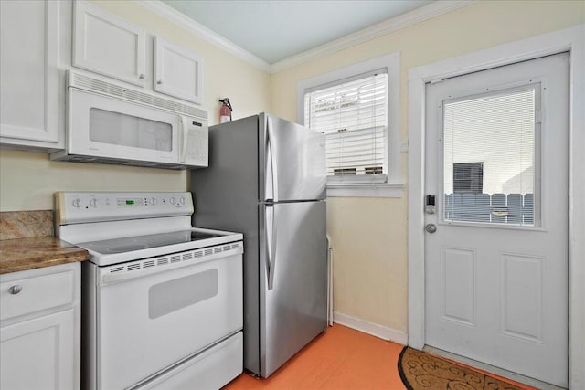 kitchen featuring white appliances, ornamental molding, and white cabinets