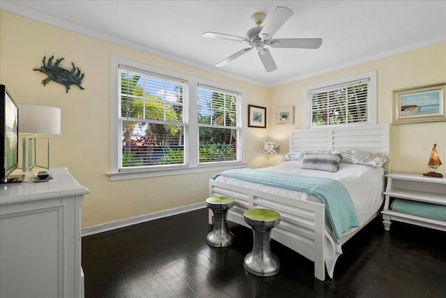 bedroom featuring ornamental molding, dark hardwood / wood-style floors, and ceiling fan