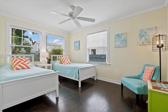 bedroom with dark hardwood / wood-style flooring, crown molding, and ceiling fan