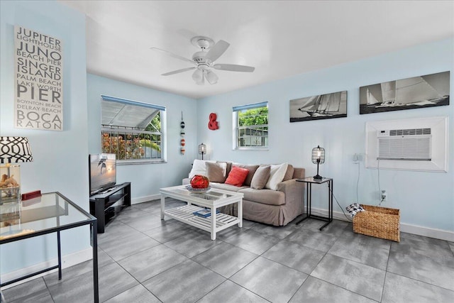 living room with ceiling fan and an AC wall unit