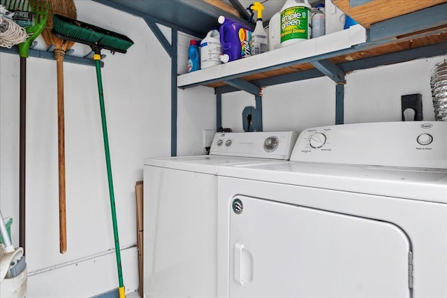 clothes washing area featuring washer and clothes dryer