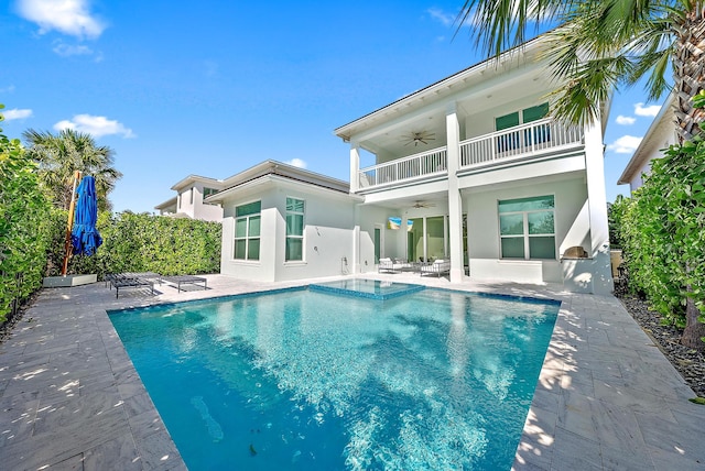 rear view of house featuring a balcony, a patio, and ceiling fan