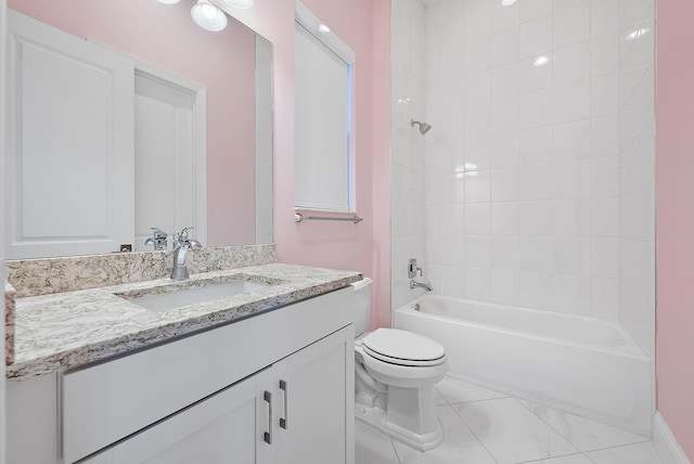 full bathroom featuring vanity, tiled shower / bath combo, and toilet