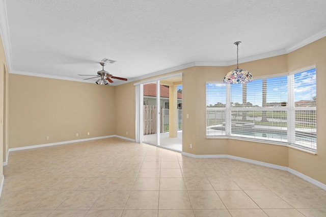 spare room with crown molding, a textured ceiling, light tile patterned floors, and plenty of natural light