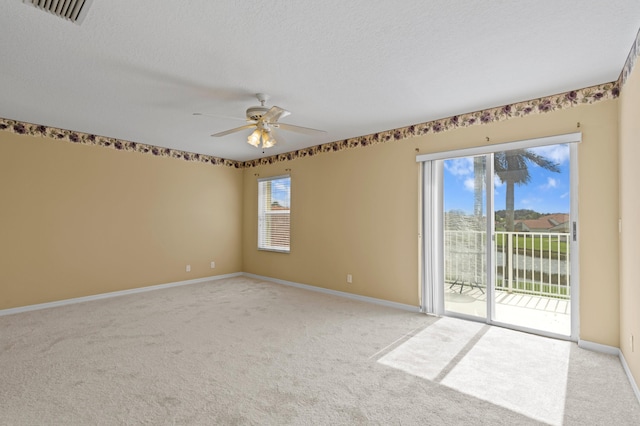 unfurnished room featuring ceiling fan, a healthy amount of sunlight, and light carpet