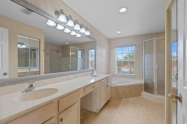 bathroom with vanity, independent shower and bath, and tile patterned flooring