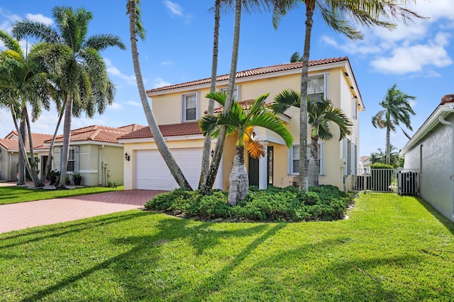 mediterranean / spanish home with a front lawn