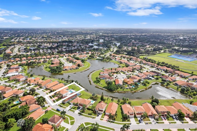 birds eye view of property with a water view