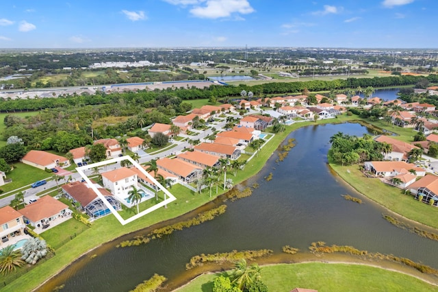 birds eye view of property featuring a water view