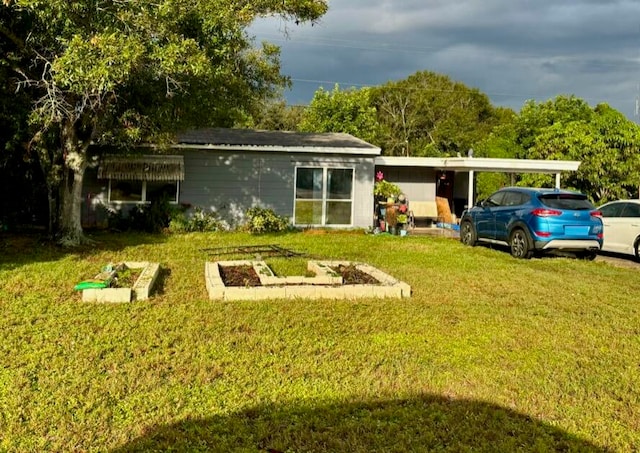 rear view of property featuring a lawn