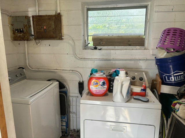 clothes washing area with washer and dryer