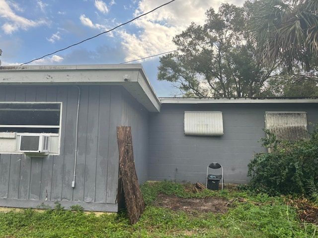 view of side of home featuring cooling unit