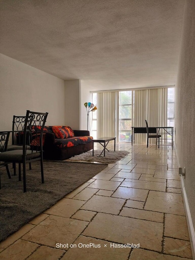 living room with a textured ceiling