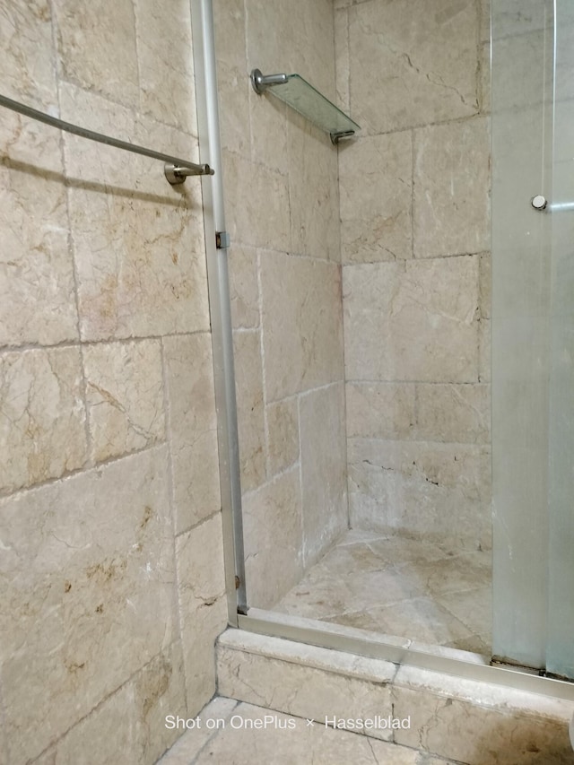 bathroom with toilet and walk in shower