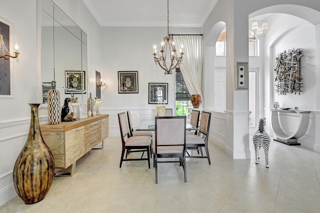 tiled dining space featuring crown molding and a high ceiling