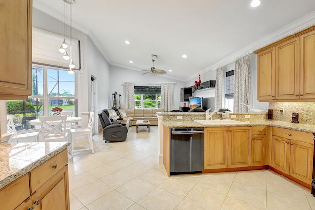 kitchen with lofted ceiling, ornamental molding, sink, light stone countertops, and stainless steel dishwasher