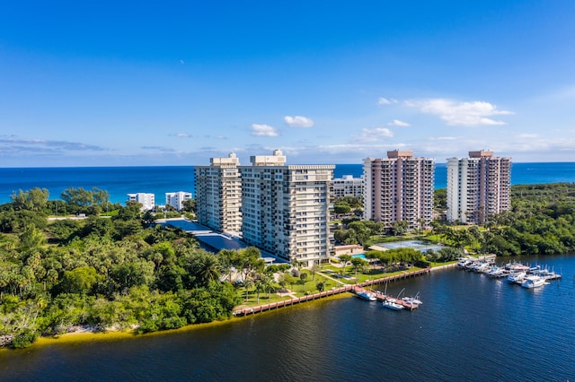 birds eye view of property featuring a water view and a view of city