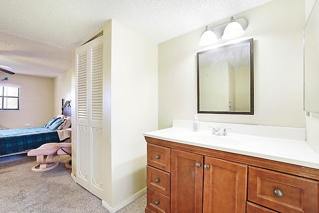 bathroom with vanity and a textured ceiling